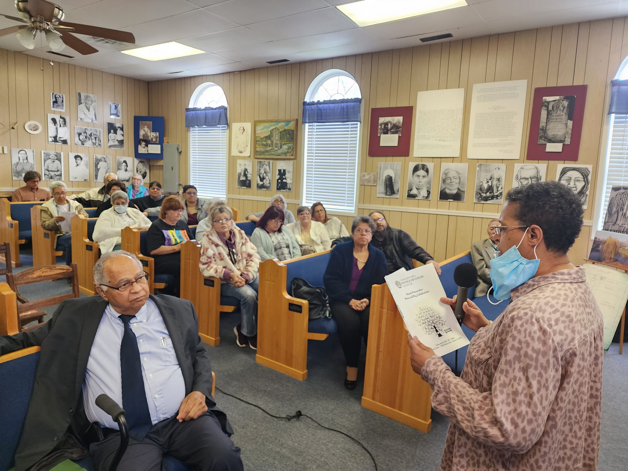 group of people sitting in Kilvert Church listening to a presentation