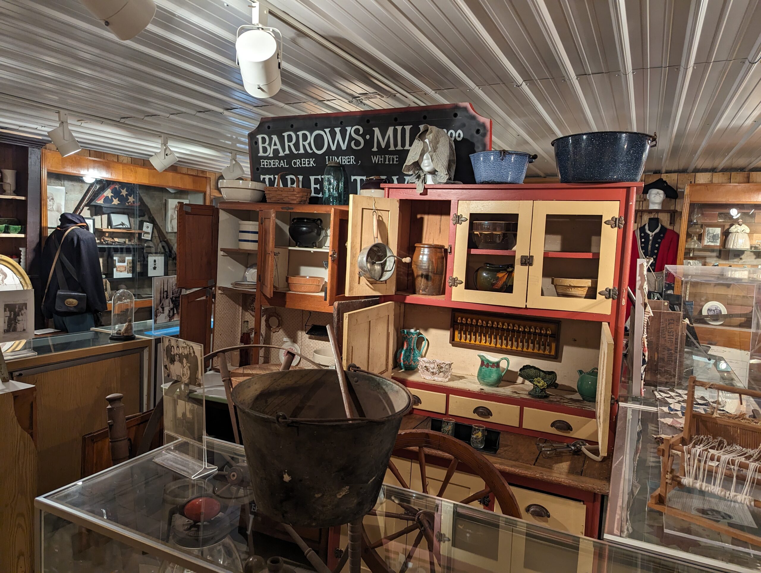 photo of many different antiques and relics on display in the museum like pottery and wooden bowls